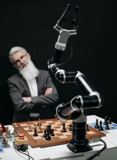 person playing chess with a robot